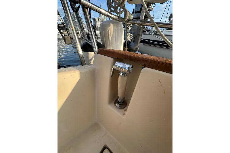 Slide: The Image of Cockpit view of a 1991 Island Packet 35 sailboat with a chrome handle. - 15
