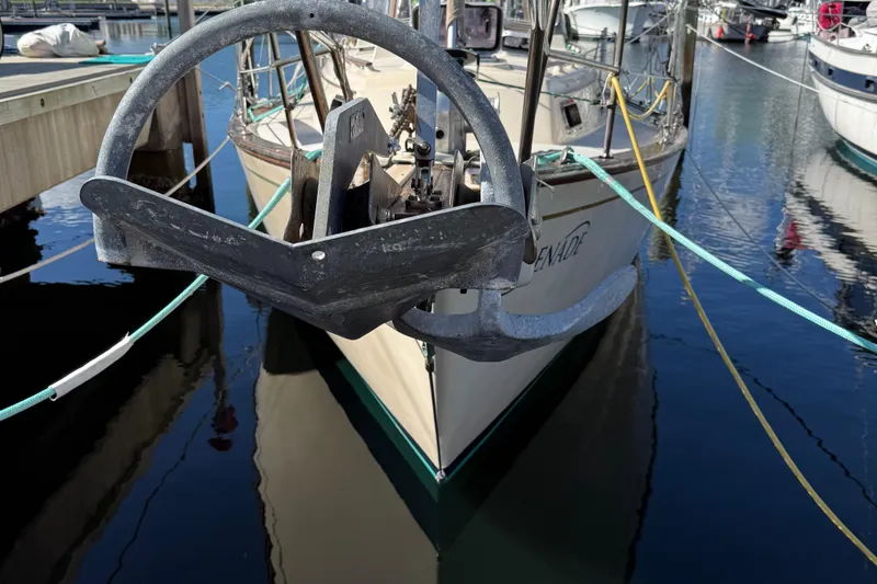 Slide: The Image of 1991 Island Packet 35 sailboat with anchor, docked in marina. - 3