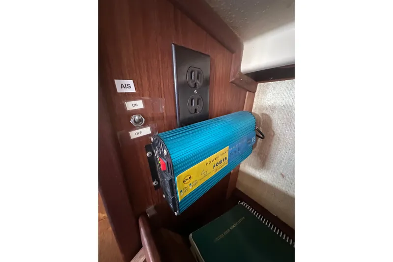 Slide: The Image of Power inverter and AIS switch inside 1991 Island Packet 35 sailboat cabin. - 34