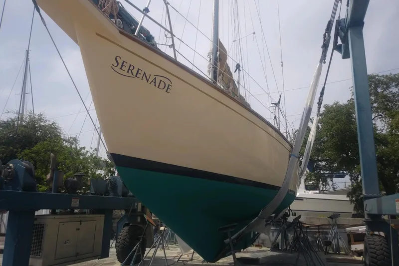 Slide: The Image of 1991 Island Packet 35 sailboat "Serenade" in dry dock, hull view. - 38