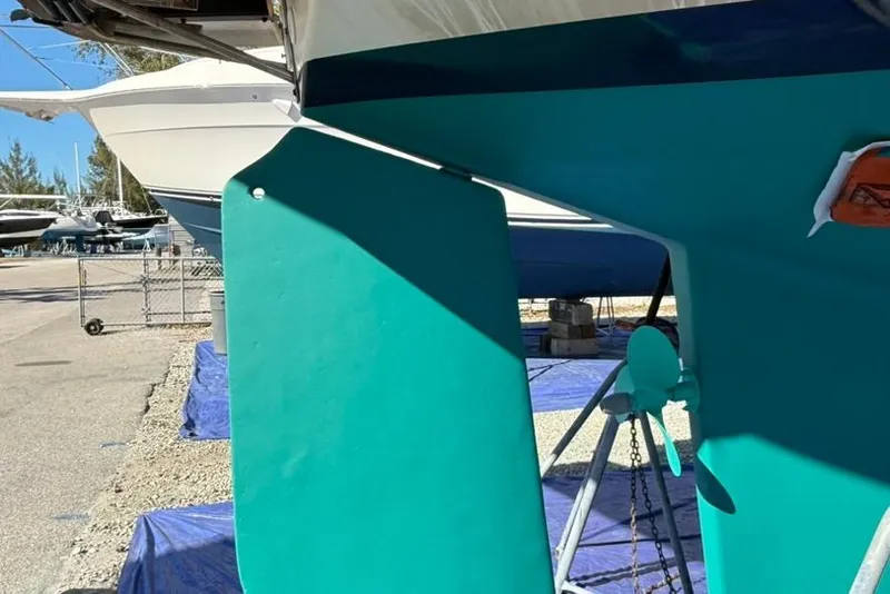 Slide: The Image of 1991 Island Packet 35 sailboat keel and rudder in dry dock. - 47