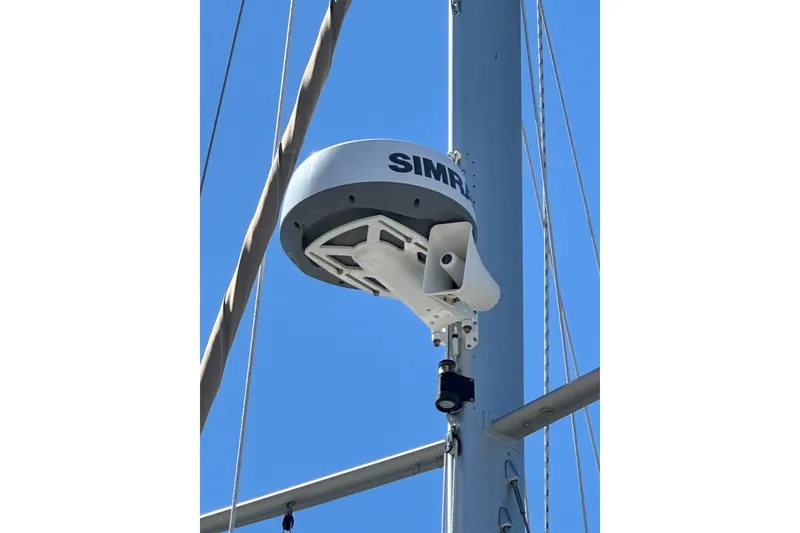 Slide: The Image of Radar equipment on 1991 Island Packet 35 sailboat mast against clear blue sky. - 9