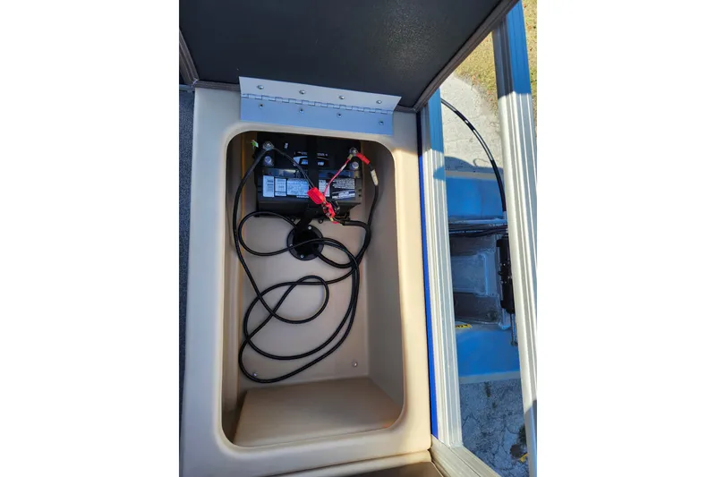 Slide: The Image of 2018 Sun Tracker Fishin' Barge 22 DLX battery compartment with wiring. - 14