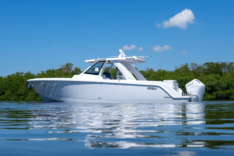 Slide: The Image of Intrepid 35 PANACEA 2026 on calm water under blue sky. - 1