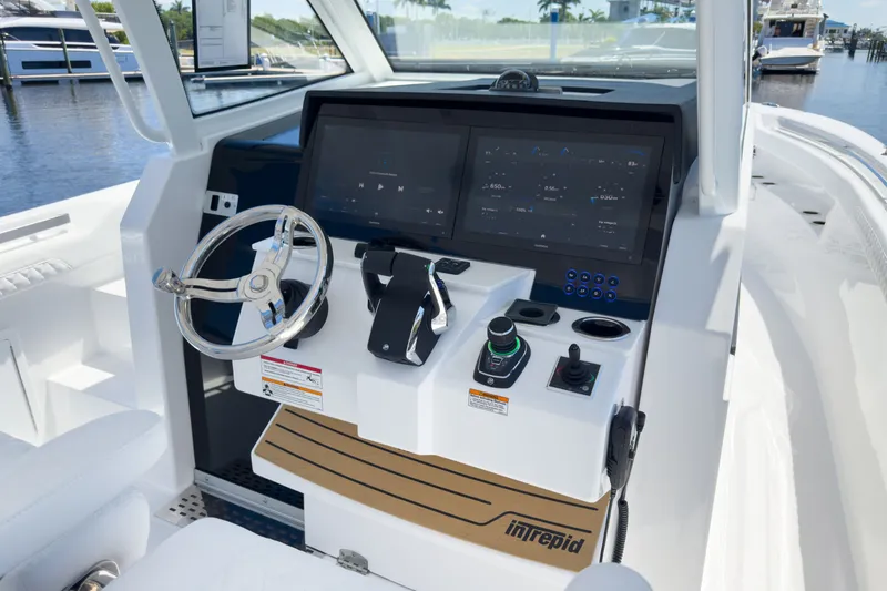 Slide: The Image of Intrepid 35 PANACEA 2026 helm with modern electronics. - 11