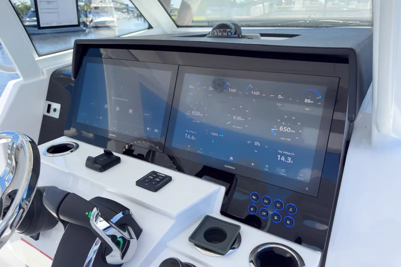 Slide: The Image of Intrepid 35 PANACEA 2026 boat console with modern instruments. - 12