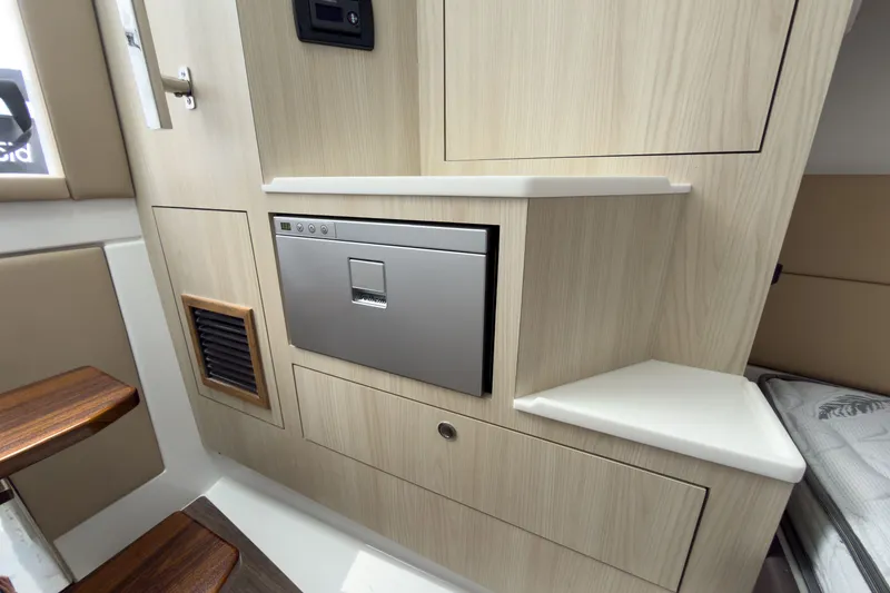 Slide: The Image of Interior of Intrepid 35 PANACEA 2026 with wood paneling. - 17