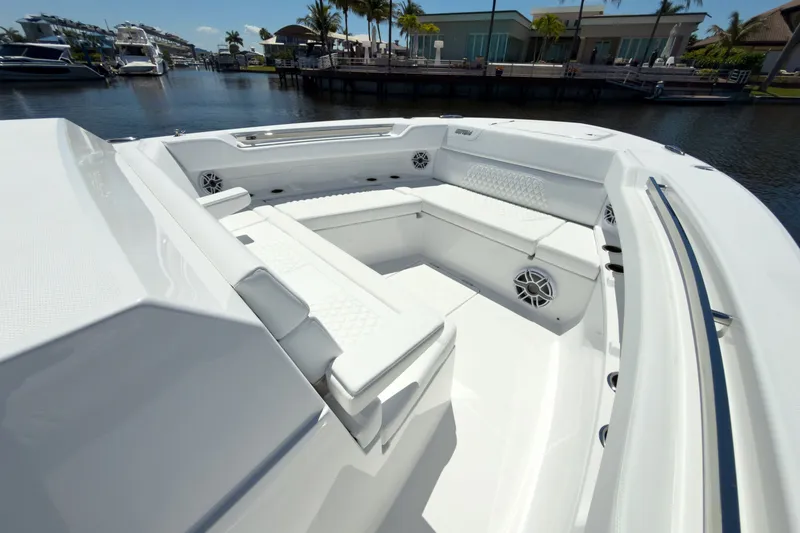 Slide: The Image of Intrepid 35 PANACEA 2026, luxurious boat seating area by the water. - 22