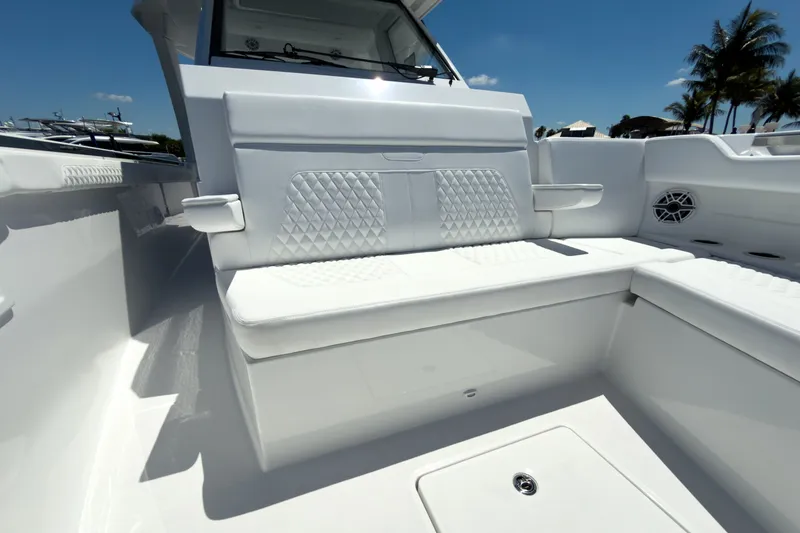 Slide: The Image of Intrepid 35 PANACEA 2026, luxurious white boat seating, sunny day. - 23