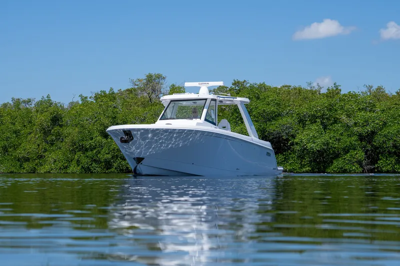 Slide: The Image of Intrepid 35 PANACEA 2026 on calm water with green backdrop. - 27