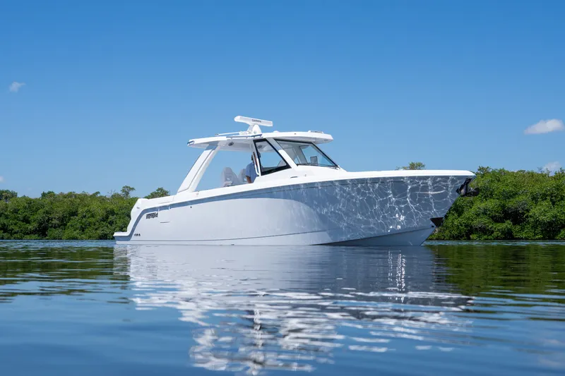 Slide: The Image of Intrepid 35 PANACEA 2026 on calm water under blue sky. - 29
