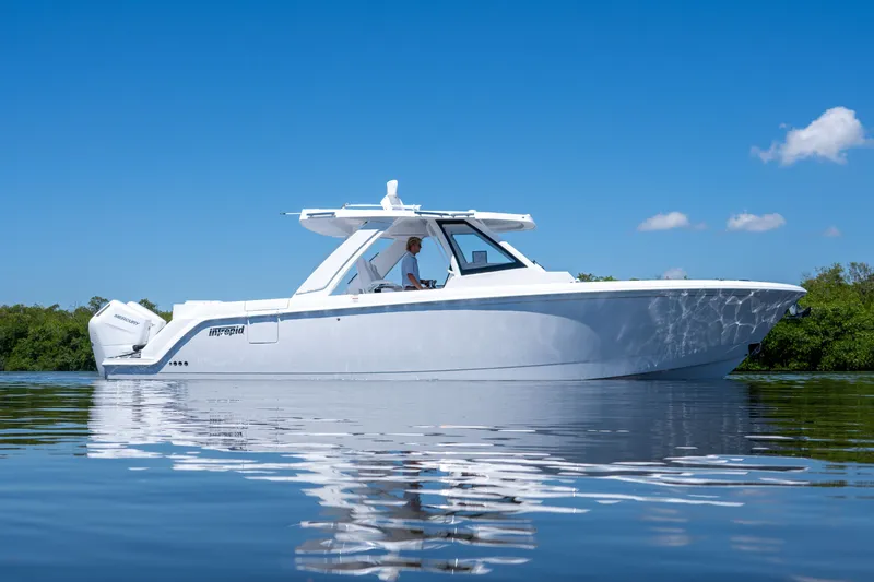 Slide: The Image of Intrepid 35 PANACEA 2026 on calm water under clear sky. - 30