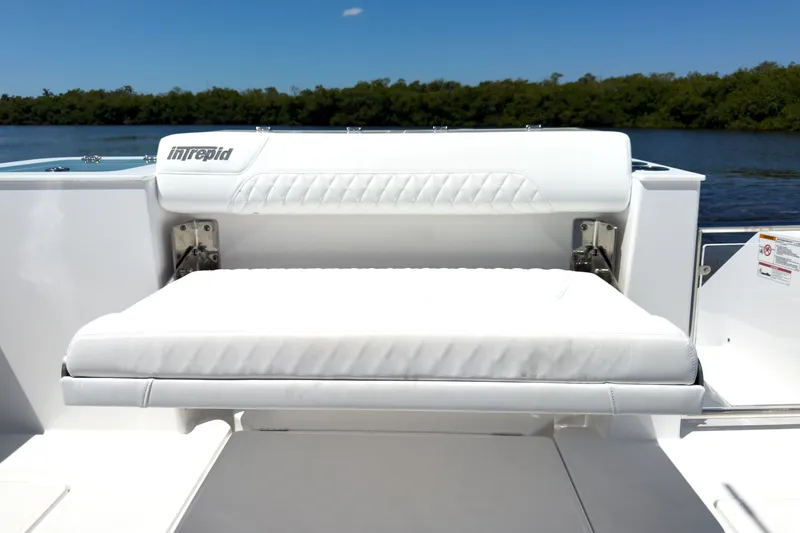 Slide: The Image of Intrepid 35 PANACEA 2026 boat seat on calm water. - 6