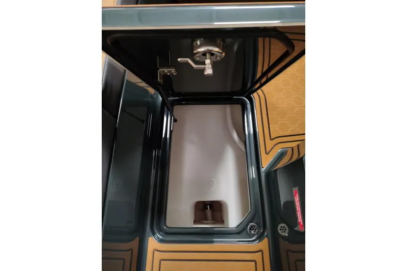 Slide: The Image of 2026 Cobalt R8 Surf boat storage compartment with sleek design and modern features. - 12
