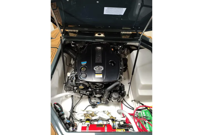 Slide: The Image of Engine compartment of a 2026 Cobalt R8 Surf boat, showcasing detailed components and wiring. - 16