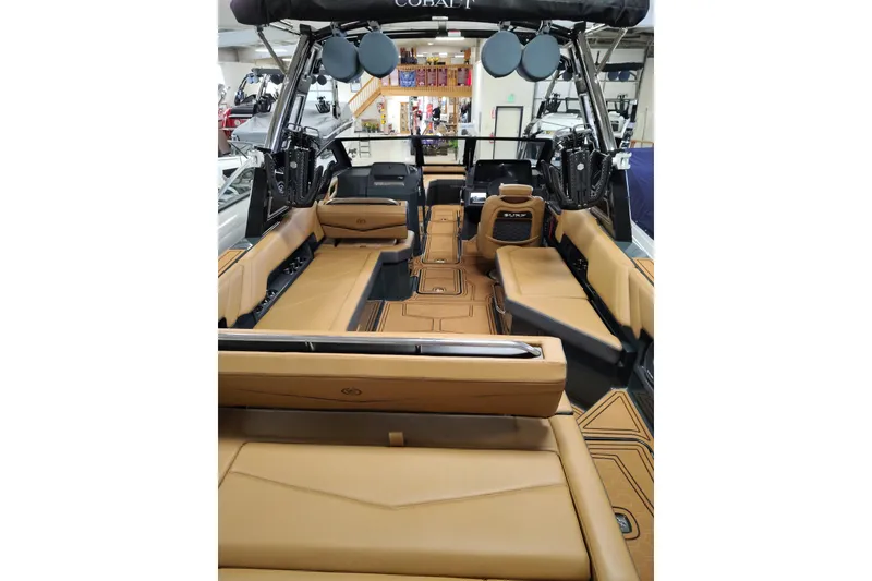 Slide: The Image of 2026 Cobalt R8 Surf boat interior with tan seating and modern design. - 17