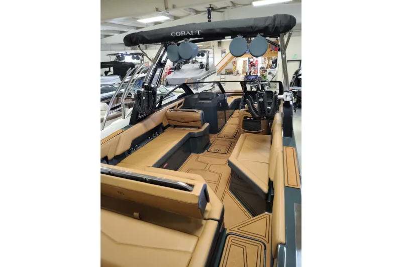 Slide: The Image of 2026 Cobalt R8 Surf boat interior with tan seating and modern design. - 19