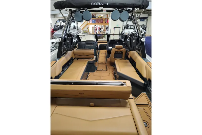 Slide: The Image of 2026 Cobalt R8 Surf boat interior with tan seating and modern design. - 20