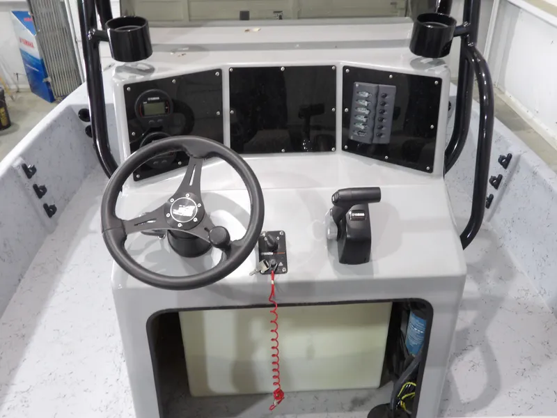 Slide: The Image of Control console of Freedom 18 PATRIOT CAT 2024 boat. - 18