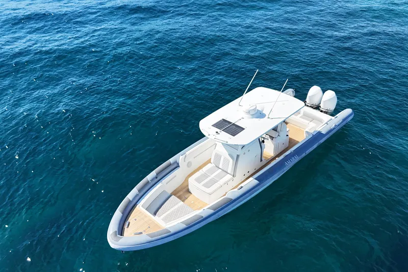 Slide: The Image of Aerial view of 2022 Ocean 1 model 370 boat on clear blue water. - 10