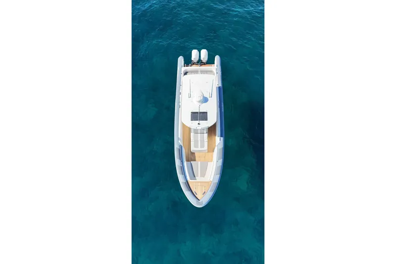 Slide: The Image of Aerial view of 2022 Ocean 1 model 370 boat on clear blue water. - 4