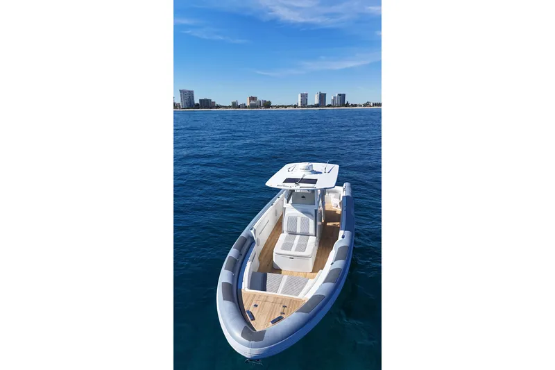 Slide: The Image of Modern Ocean 1 370 boat on blue water, city skyline in background, 2022 model. - 5
