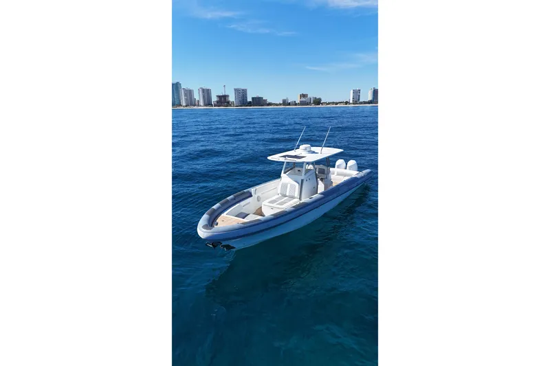 Slide: The Image of Ocean 1 370 boat on blue water with city skyline in background, 2022 model. - 7