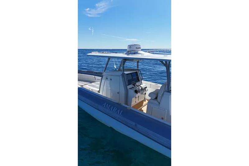 Slide: The Image of 2022 Ocean 1 370 boat on clear blue water, featuring sleek design and modern navigation equipment. - 8