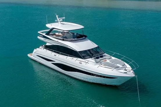Slide: The Image of Manufacturer Provided Image: Luxurious 2026 Princess F65 yacht cruising on clear blue water. - 2