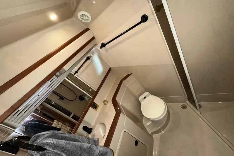 Slide: The Image of Bathroom interior of 1999 Cruisers Yachts 3870 Esprit with modern fixtures and wood accents. - 20