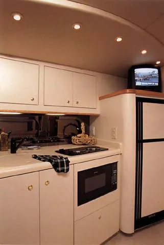 Slide: The Image of 1999 Cruisers Yachts 3870 Esprit interior with sleek seating and modern design. - 5