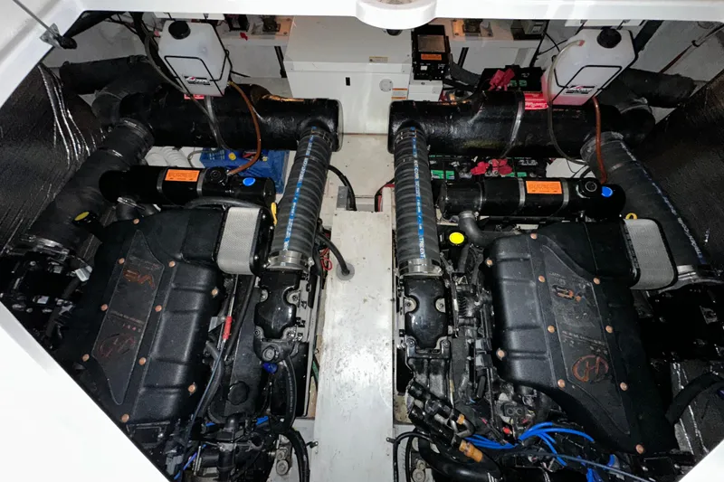 Slide: The Image of Engine room of 1999 Cruisers Yachts 3870 Esprit with dual engines and components. - 25