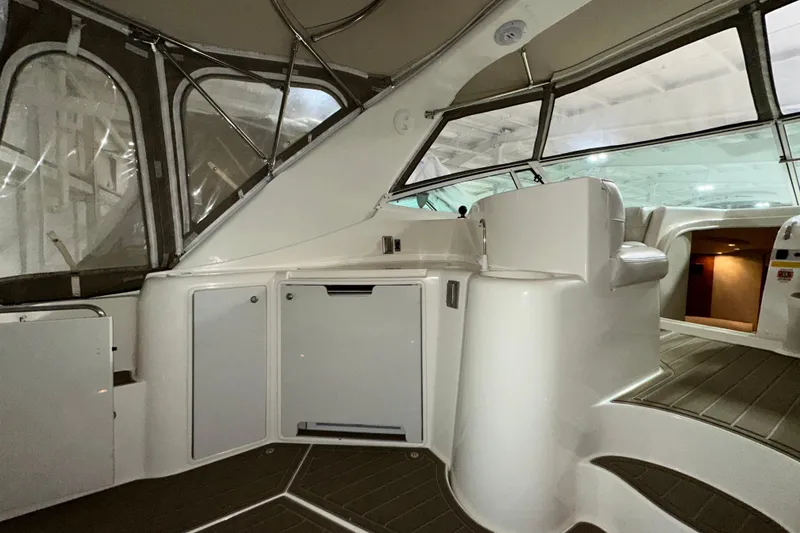 Slide: The Image of 1999 Cruisers Yachts 3870 Esprit interior with seating and cabinetry. - 7