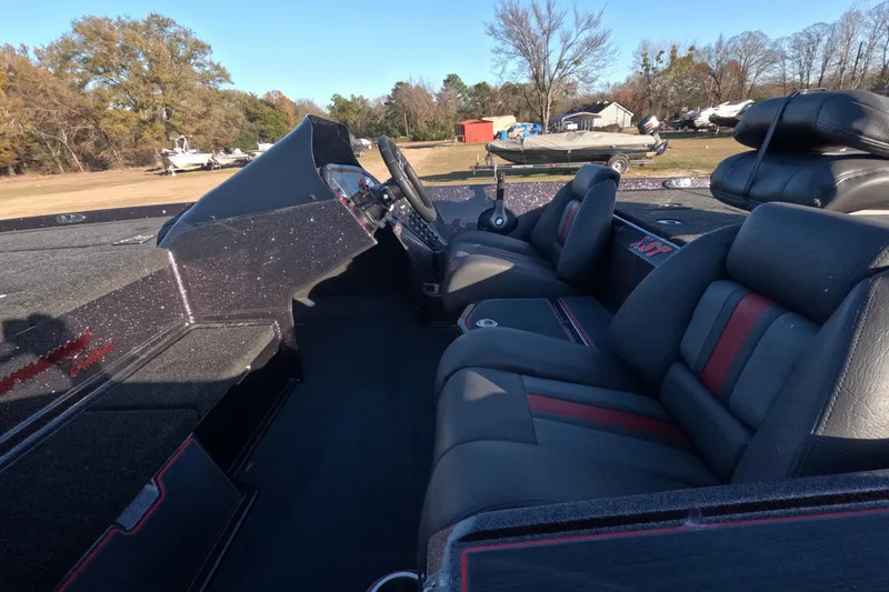 Slide: The Image of Interior of a 2026 Bullet 21XST boat with sleek seating and steering console. - 6