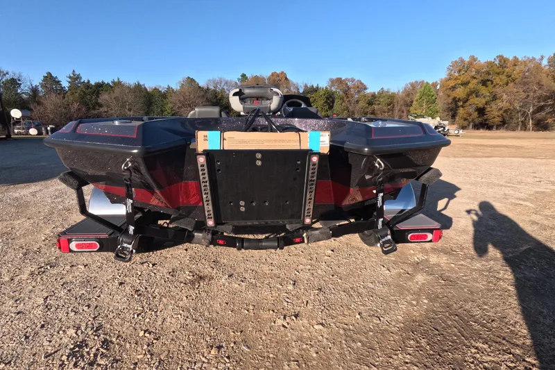 Slide: The Image of Rear view of 2026 Bullet 21XST boat on a trailer in a sunny outdoor setting. - 8
