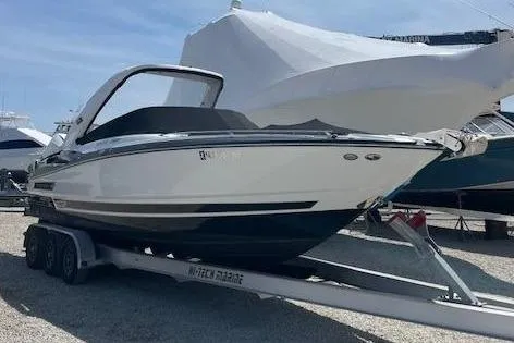 Slide: The Image of 2021 Monterey 305SS Super Sport boat on trailer outdoors. - 3