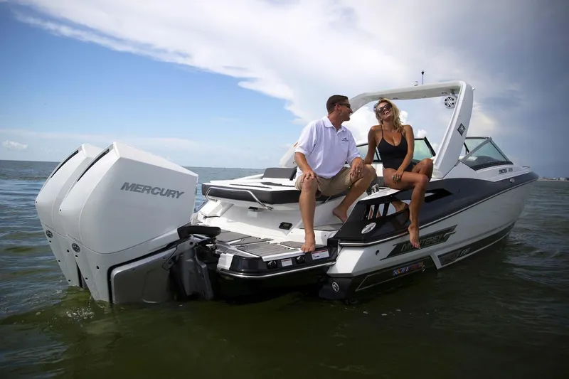 Slide: The Image of Manufacturer Provided Image: Couple enjoying a day on a 2021 Monterey 305SS Super Sport boat. - 9