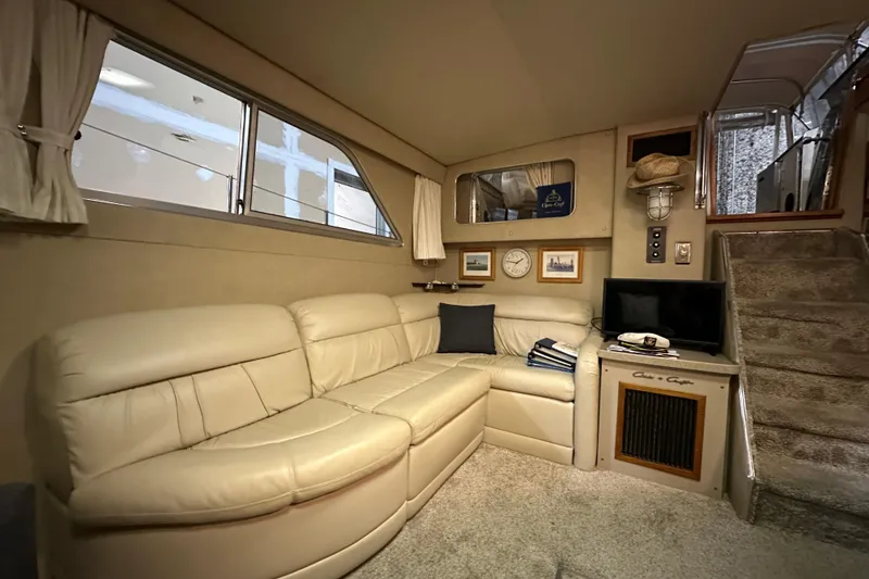 Slide: The Image of Luxurious interior of 1986 Chris-Craft 381 Catalina yacht with beige leather seating. - 11