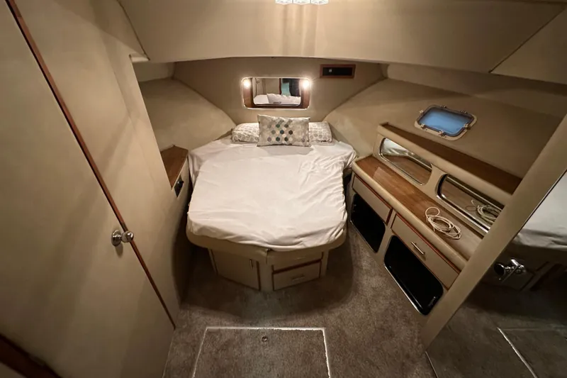 Slide: The Image of Cozy cabin interior of 1986 Chris-Craft 381 Catalina with bed and storage. - 21