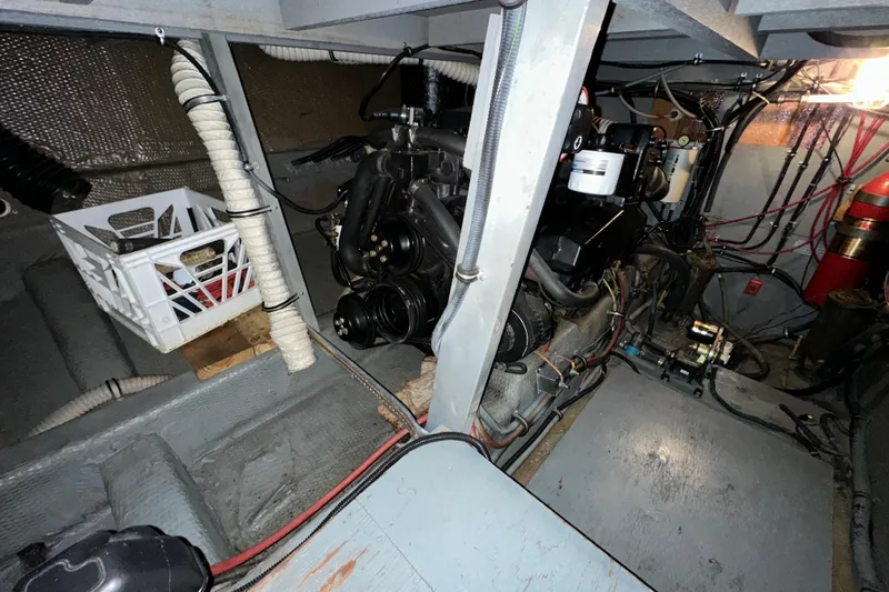 Slide: The Image of Engine room of 1986 Chris-Craft 381 Catalina with visible components and wiring. - 28