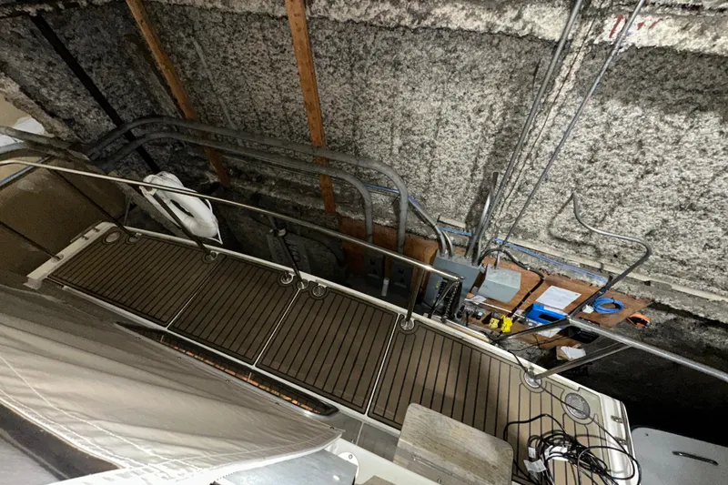 Slide: The Image of 1986 Chris-Craft 381 Catalina boat docked in an indoor storage facility. - 4