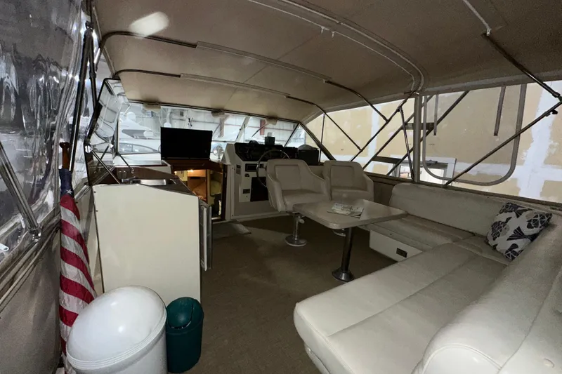 Slide: The Image of Interior of 1986 Chris-Craft 381 Catalina yacht with seating and helm area. - 6