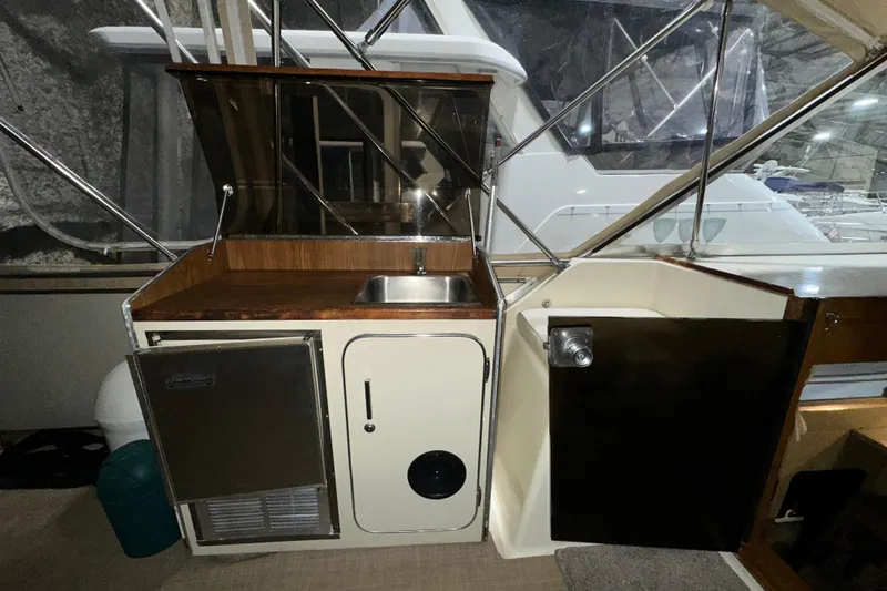 Slide: The Image of 1986 Chris-Craft 381 Catalina yacht interior with sink and storage area. - 8