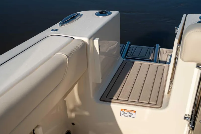 Slide: The Image of 2026 Scout 220 XSF boat interior with cushioned seating and non-slip deck. - 14