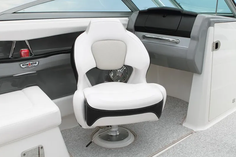 Slide: The Image of Manufacturer Provided Image: 2012 Chaparral 226 SSi boat interior with white captain's chair. - 13