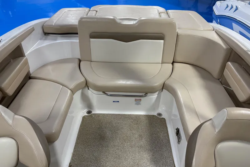 Slide: The Image of 2012 Chaparral 226 SSi boat interior with beige seating and carpeted floor. - 4