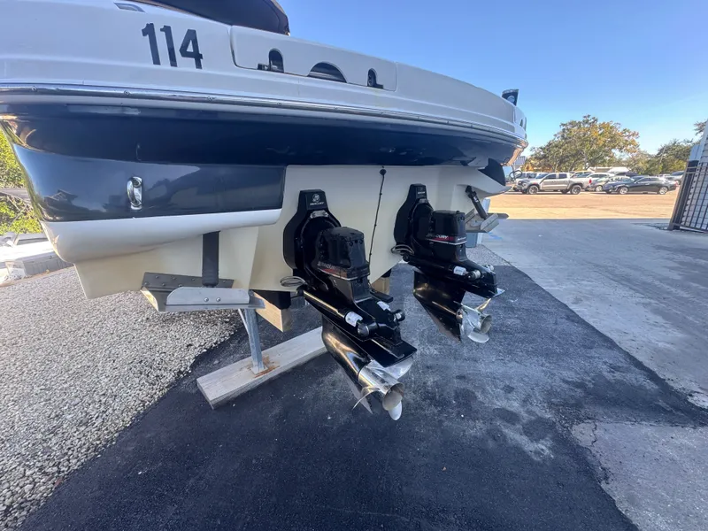 Slide: The Image of Rear view of a 2002 Sea Ray 290 Bowrider with dual engines. - 10