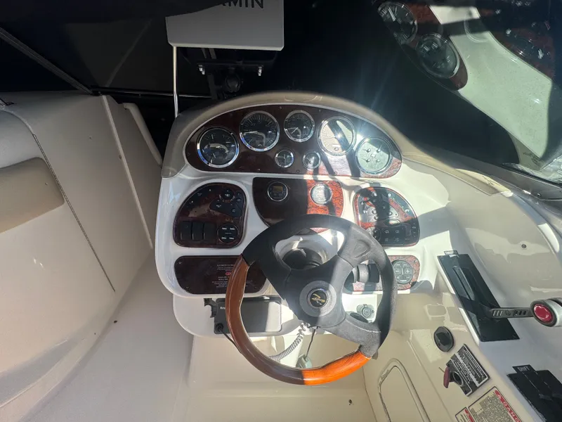 Slide: The Image of Cockpit of a 2002 Sea Ray 290 Bowrider boat. - 15