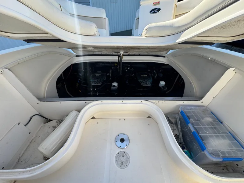 Slide: The Image of Engine compartment of a 2002 Sea Ray 290 Bowrider boat. - 24