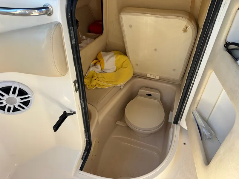 Slide: The Image of Interior of a 2002 Sea Ray 290 Bowrider with toilet. - 31